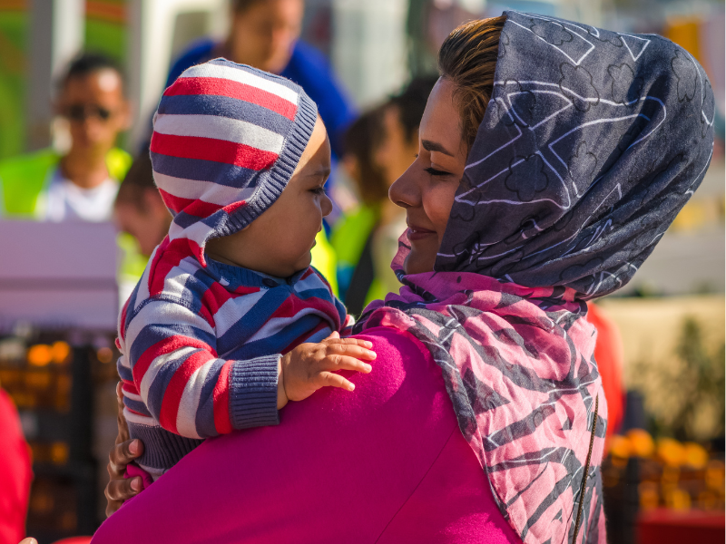 Woman holds a child