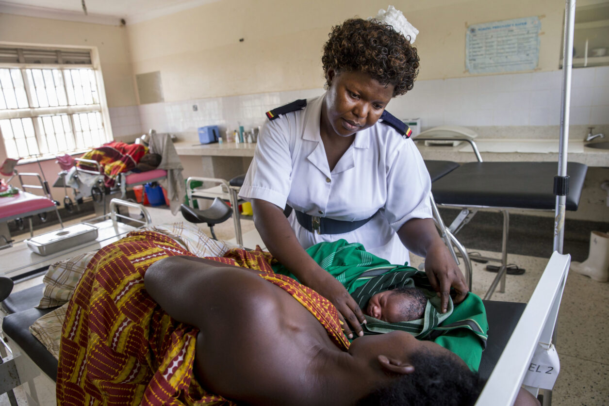 Head antenatal nurse Margie Harriet Egessa providing antenatal counseling and checkups for a group of pregnant women at clinic in Uganda.